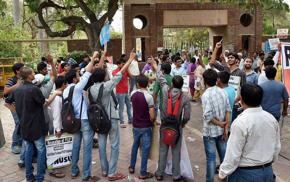 AISA activists shout slogans during a protest over controversial FYUP at Delhi University campus.