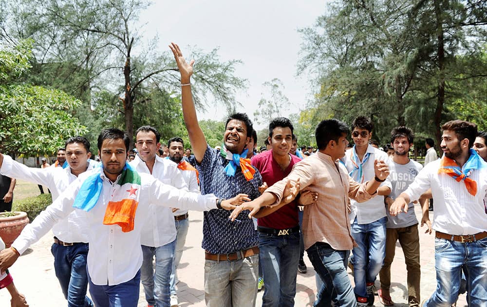 NSUI activists shout slogans during a protest over controversial FYUP at Delhi University campus.