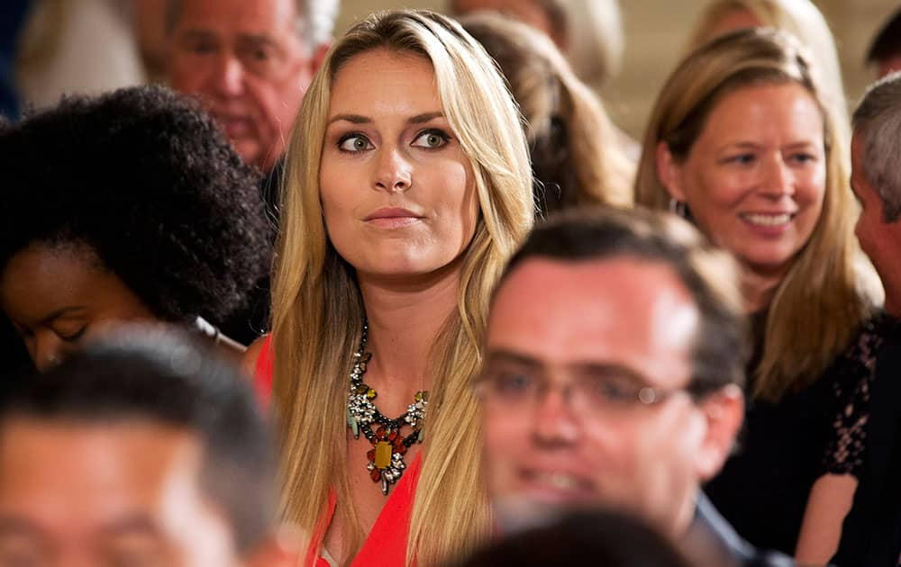 American World Cup alpine ski racer Lindsey Vonn, the girlfriend of Tiger Woods, attends a ceremony in the East Room of the White House, honoring members of the 2013 Presidents Cup team, including Woods, in Washington. 