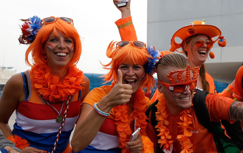 Dutch fans cheers for their national before the group B World Cup soccer match between the Netherlands and Chile at the Itaquerao Stadium in Sao Paulo, Brazil.