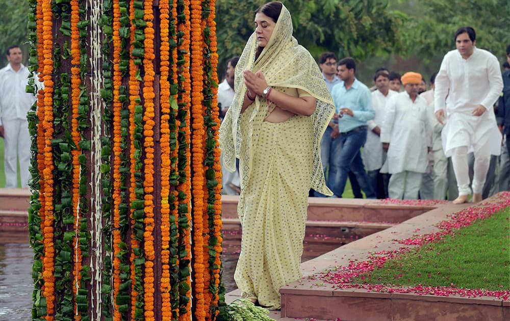 Women and Child Welfare Minister Maneka Gandhi with her son & BJP MP Varun Gandhi pay tribute to her husband Sanjay Gandhi on his death anniversary at his memorial in New Delhi.