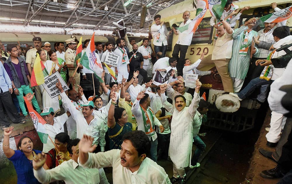 Congress workers protesting against the Union government over proposed hike in railway fares at CST Railway Station in Mumbai.