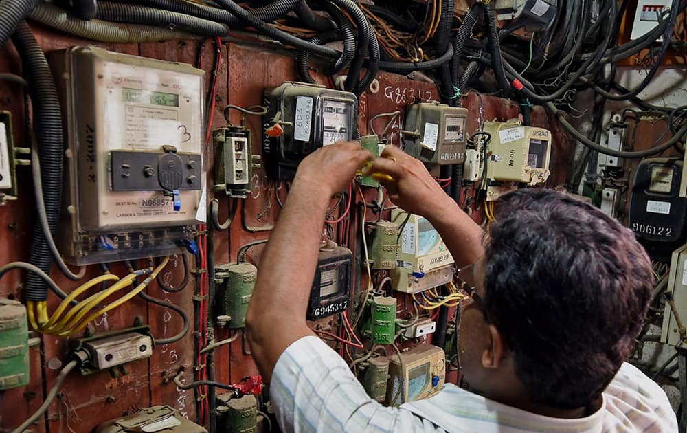 BMC officials disconnect the electric supply to the Campa Cola Society in Mumbai.