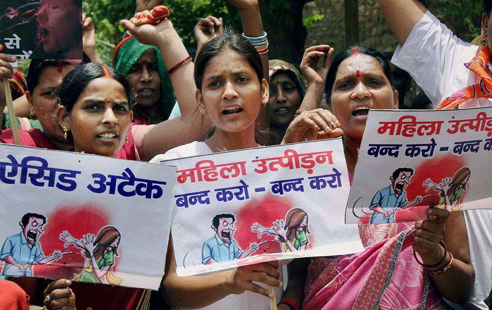 People protest against the law and order condition in UP and demanding a ban on acid sale for women safety in Allahabad.