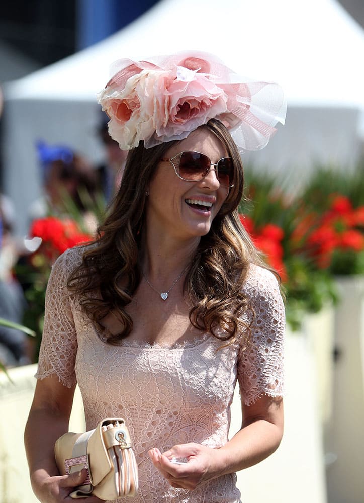 British actress Elizabeth Hurley arrives for day five of the 2014 Royal Ascot Meeting at Ascot Racecourse, Berkshire, England.