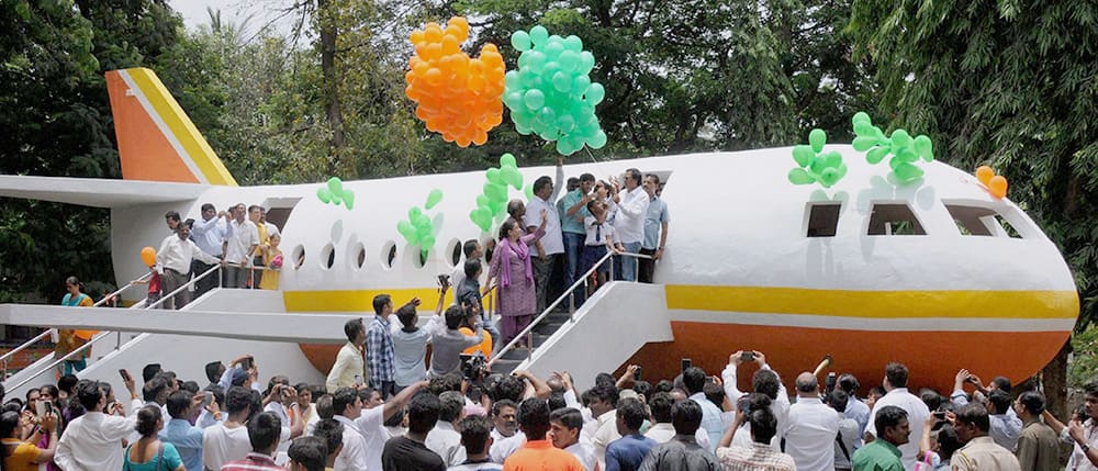 Yuva Sena President Aditya Thackeray along with others releasing balloons from a model of aircraft during the inauguration of Juhu Garden in Mumbai.