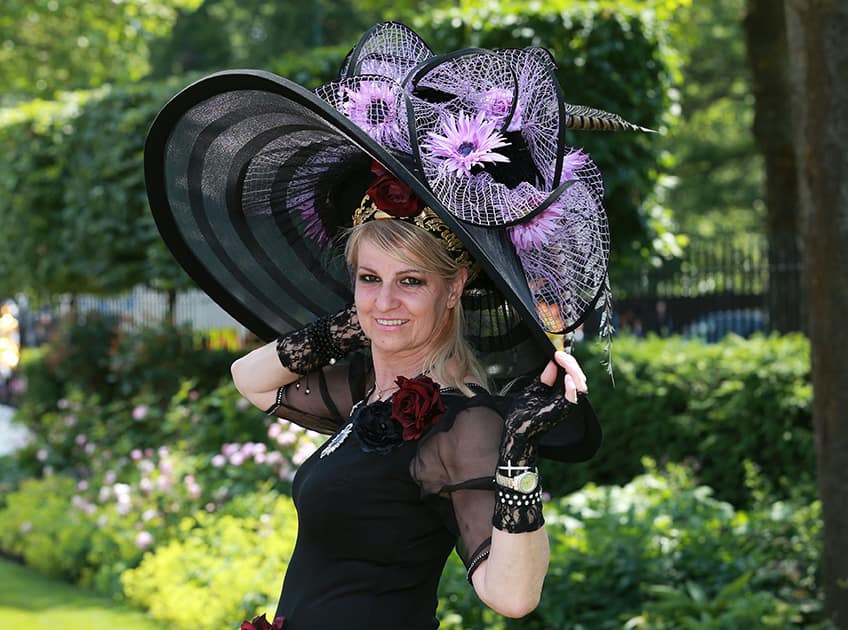 A spectator models an ornate hat on day five of the 2014 Royal Ascot Meeting at Ascot Racecourse, Berkshire, England.