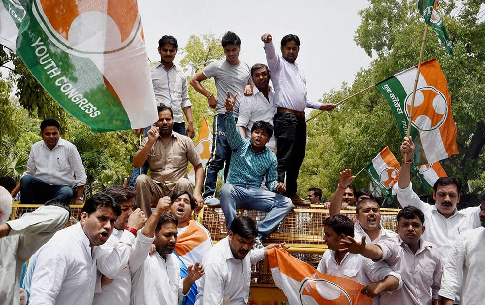 Youth Congress activists shout slogans during a protest against proposed rail fare hike, in New Delhi.