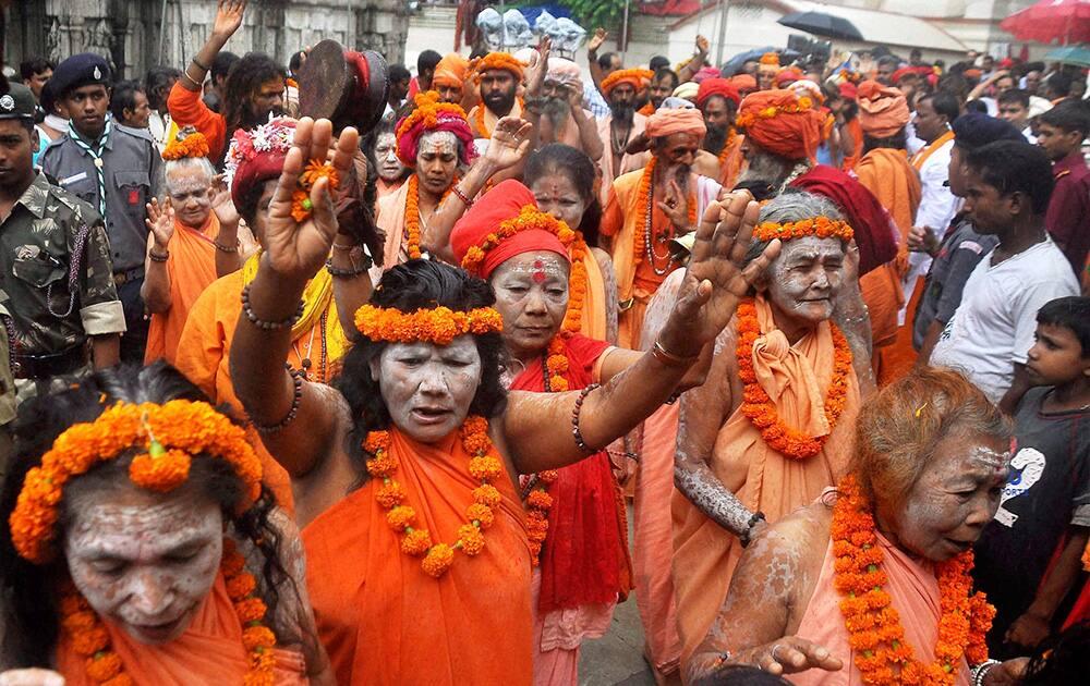 Sadhus sing songs at Kamakhya temple in Guwahati on the eve of Ambubachi Mela.