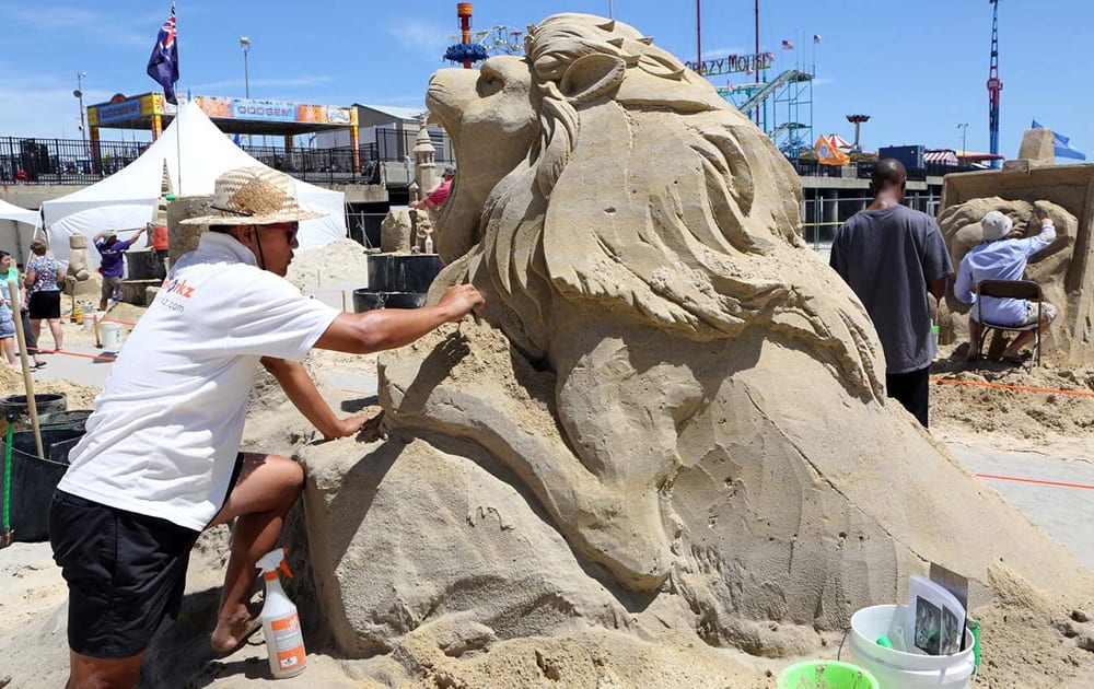 Jooheng Tan, of Singapore, works on his sand creation during the DO AC Sand Sculpting World Cup singles event on the beach in Atlantic City, N.J.