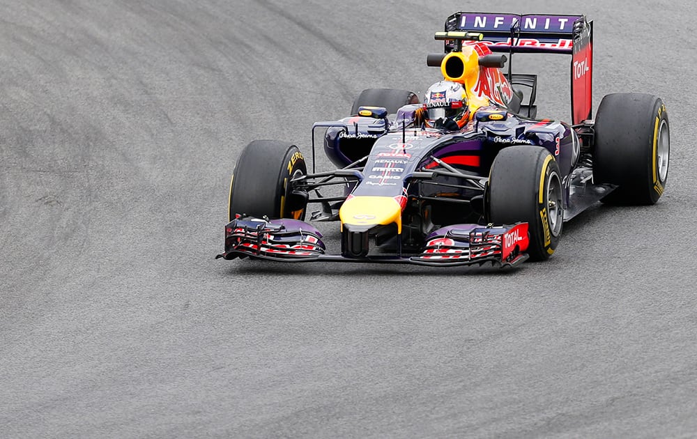 Red Bull driver Daniel Ricciardo of Australia steers his car during the first free practice session for Sunday`s Austrian Grand Prix at the Spielberg track, Austria. The Austrian Grand Prix will be held Sunday, June 22, 2014.