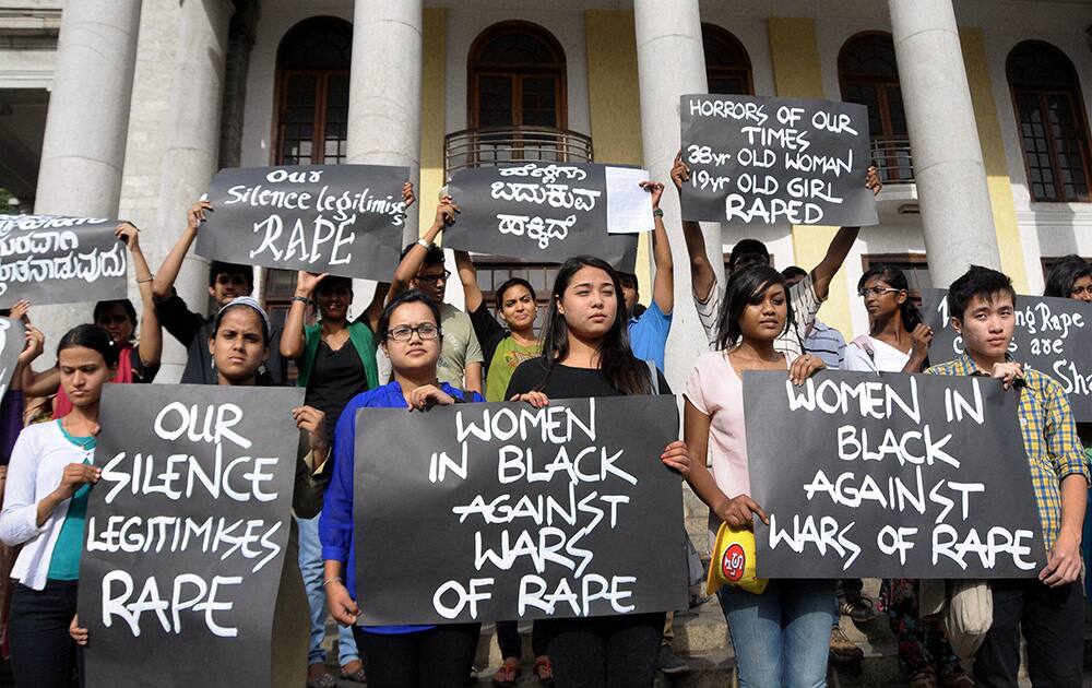 Activists of Women in Black protest against rape on women, in Bengaluru.