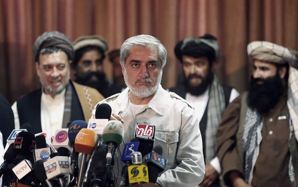 Afghanistan`s presidential candidate Abdullah Abdullah waits for journalists before a news conference in Kabul, Afghanistan.