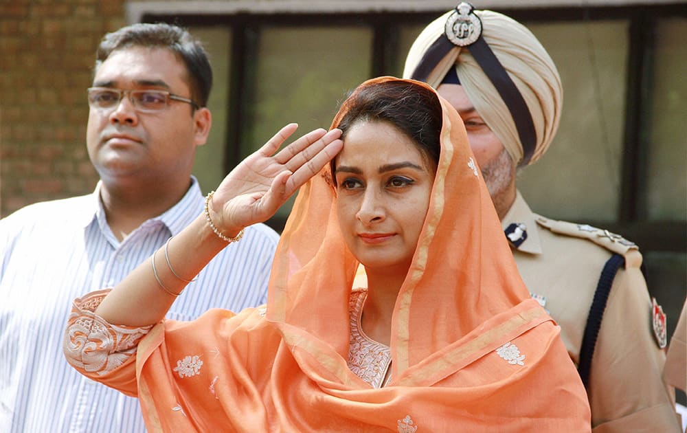 Union Minister Harsimrat Kaur Badal reviews a guard of honour at Circuit House on her maiden visit to her constituency Bathinda.