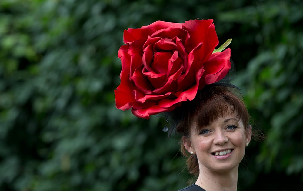 Joanne Casey wears a rose motif hat on the third day of the Royal Ascot horse racing meeting, which is traditionally known as Ladies Day, at Ascot, England.