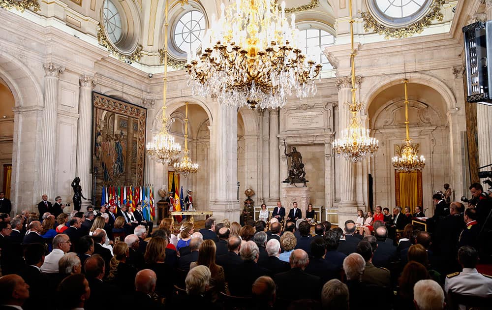 Spain`s Queen Sofia, left sits with King Juan Carlos, 2nd left, Spanish Crown Prince Felipe, 3rd left and Princess Letizia before signing an abdication law during a ceremony at the Royal Palace in Madrid, Spain.