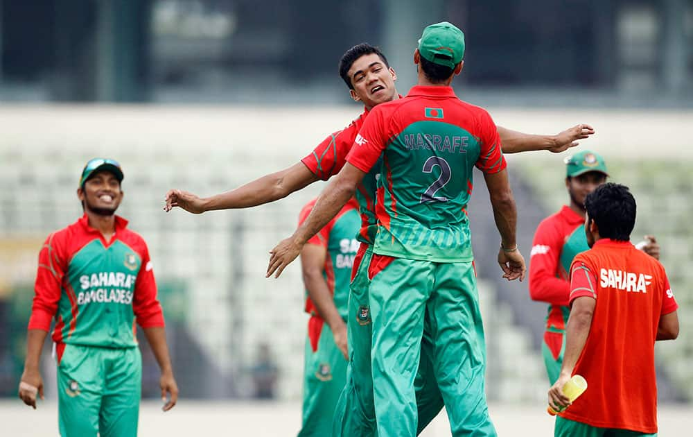 Bangladesh`s Taskin Ahmed, center facing camera, celebrates with teammates Mashrafe Mortaza after the dismissal of India`s Ambati Rayudu during their second one-day international cricket match in Dhaka, Bangladesh.