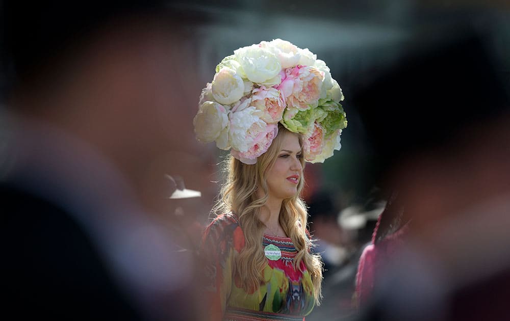 Natalie Kapchuck wears a floral hat on the second day of the Royal Ascot horse racing meeting at Ascot, England.