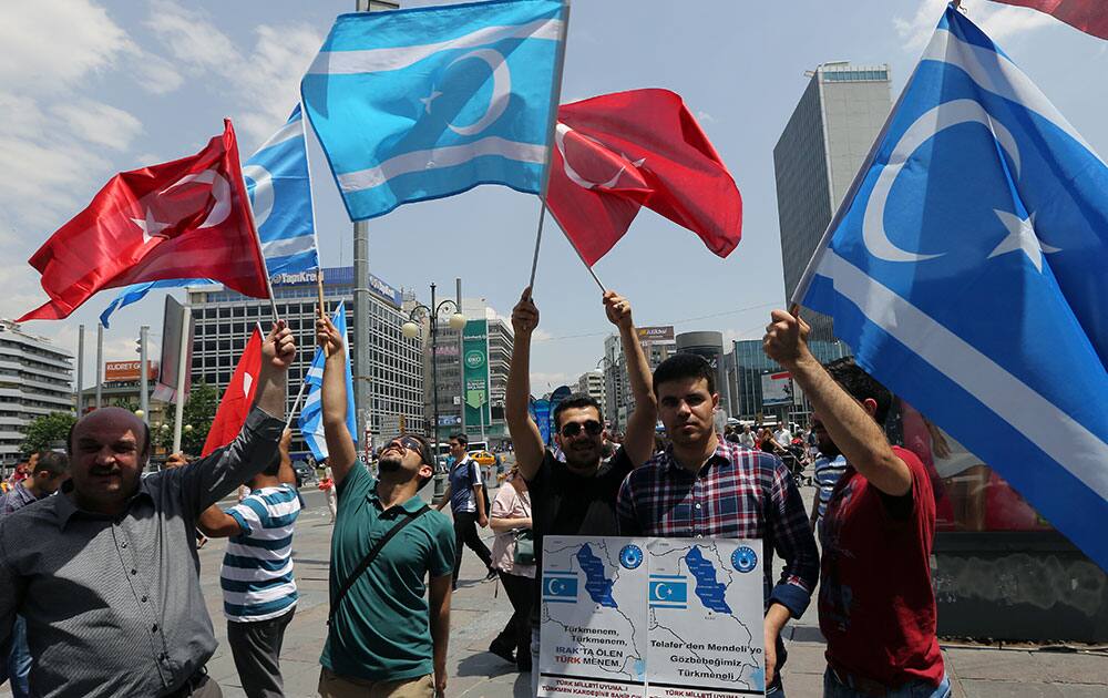 Iraqi Turkmens stage a protest to condemn the recent killings of Turkmen community members in Iraq by the militants from an al-Qaida inspired group, in Ankara, Turkey.