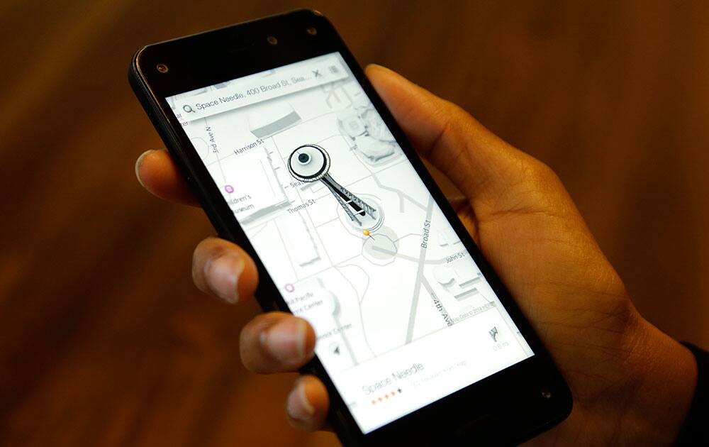 The map app on new Amazon Fire Phone is demonstrated, in Seattle. The map app includes 3D-like renderings of buildings such as the Space Needle.