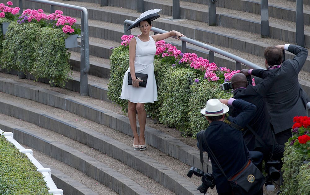 Tamara Czartoryski wears an ornate hat as she poses for photographers on the second day of the Royal Ascot horse racing meeting at Ascot, England.