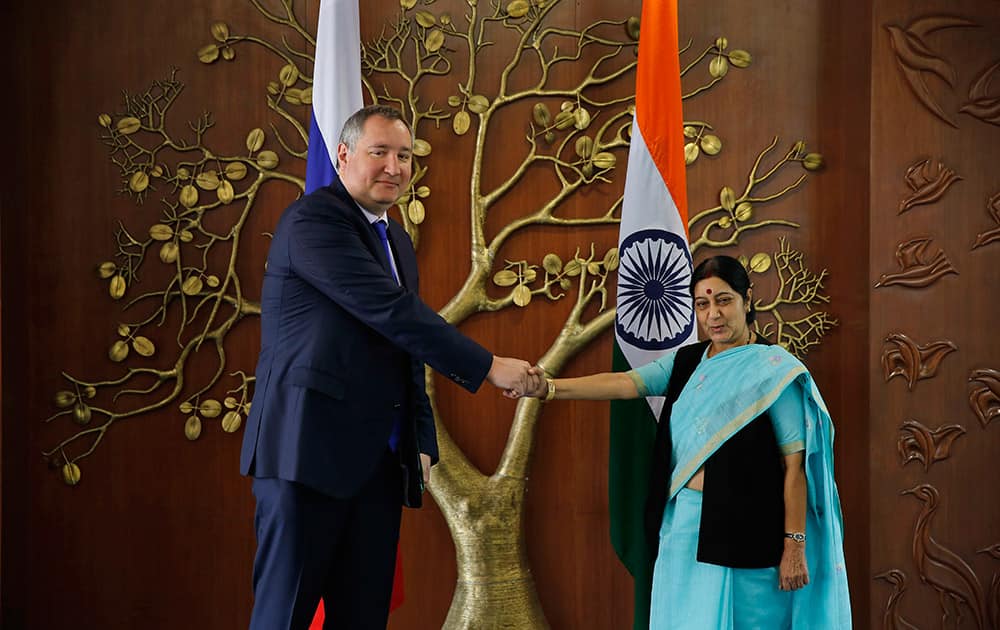 Russian Deputy Prime Minister Dmitry Rogozin and Indian Foreign Minister Sushma Swaraj, pose for the media before their meeting in New Delhi.