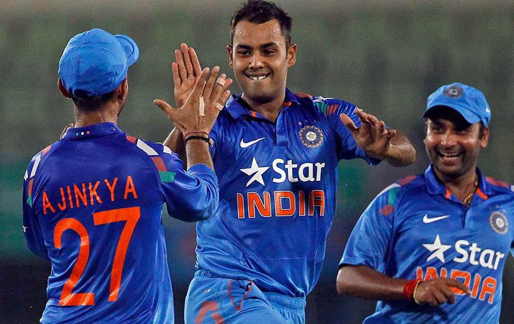 India`s Stuart Binny celebrates with teammates after the wicket of Bangladesh`s Mahmudullah during their second one-day International cricket match in Dhaka, Bangladesh.