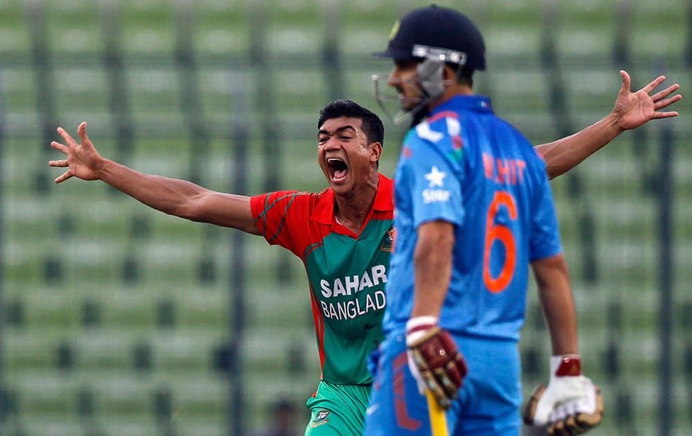 Bangladesh`s Taskin Ahmed successfully makes an LBW appeal for the dismissal of India`s Amit Mishra during their second one-day International cricket match in Dhaka, Bangladesh.