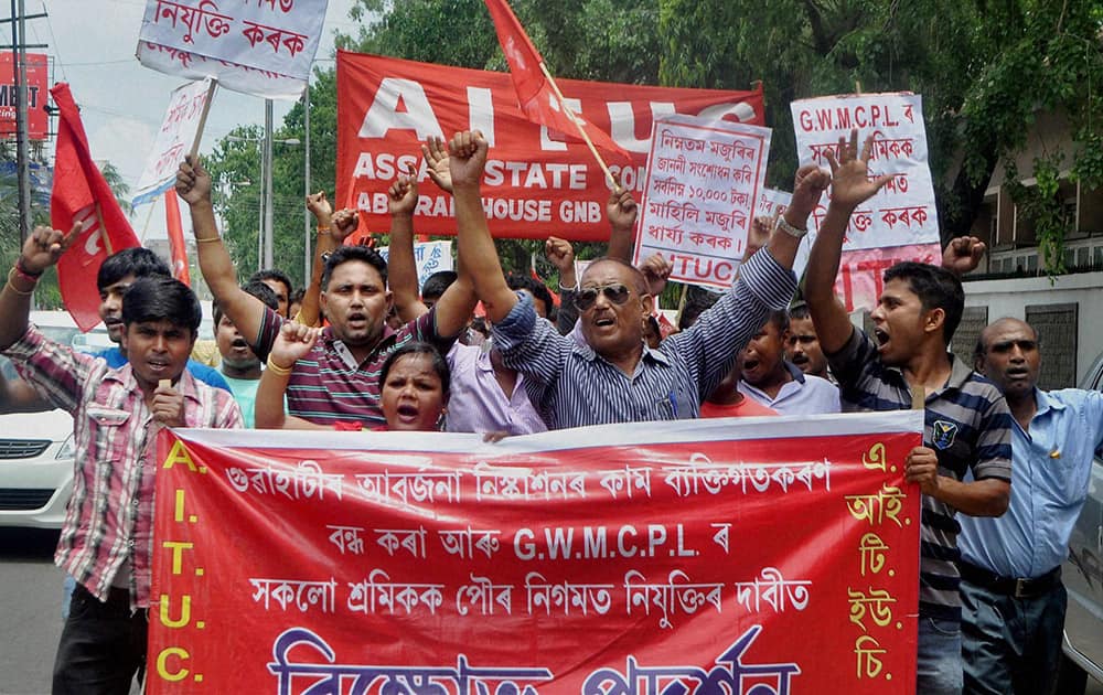 AITUC members taking out a protest rally in Guwahati on Tuesday in support of their demands.