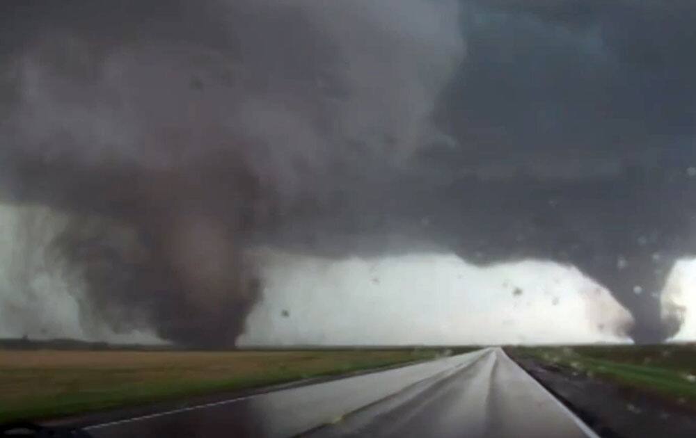 This framgrab taken from video provided by StormChasingVideo.com shows two tornados approaching Pilger, Neb. The National Weather Service said at least two twisters touched down within roughly a mile of each other Monday in northeast Nebraska. 