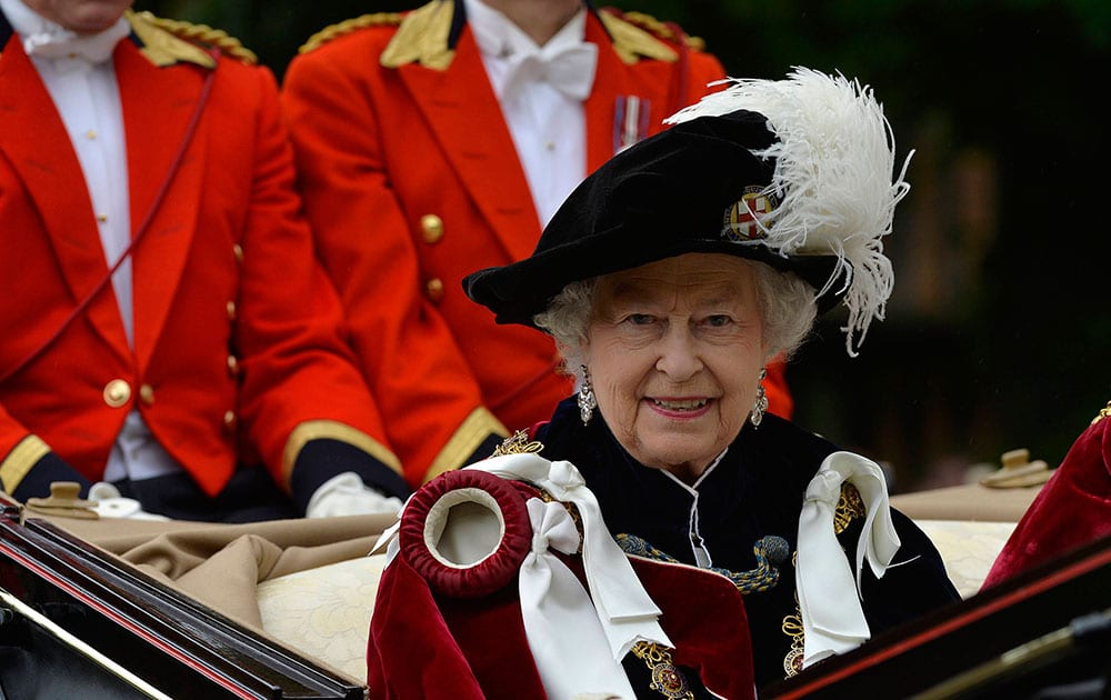 Britain`s Queen Elizabeth leaves by carriage after attending the annual Order of the Garter Ceremony in Windsor, England. The Garter Ceremony is the oldest of the ceremonial events.