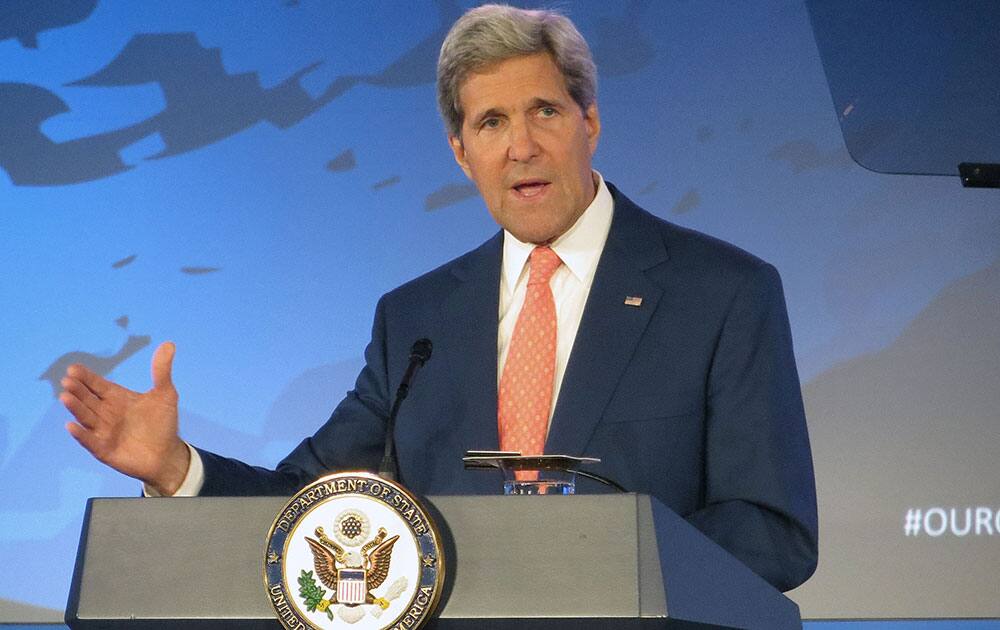 Secretary of State John Kerry addresses the Our Ocean conference, at the State Department in Washington. The Obama administration is willing to talk with Iran over deteriorating security conditions in Iraq and is not ruling out potential U.S.-Iranian military cooperation in stemming the advance of Sunni extremists, Kerry said Monday. 