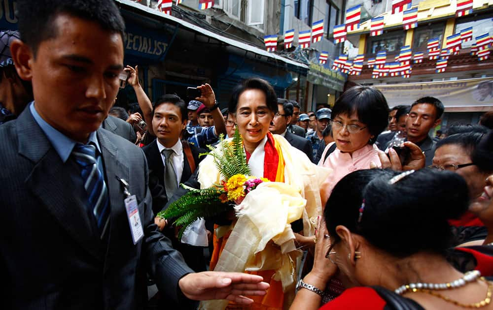 Nepalese people welcome Myanmar opposition leader Aung San Suu Kyi upon arrival at Sigal Monastery in Katmandu, Nepal. Suu Kyi arrived in Nepal Friday to attend a democracy conference, meet top political leaders and visit Buddhist pilgrimage sites.