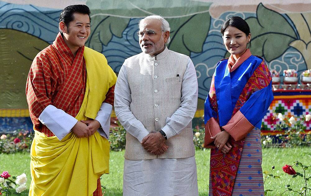 VISITING INDIAN PRIME MINISTER NARENDRA MODI, STANDS WITH BHUTAN`S KING JIGME KHESAR NAMGYEL WANGCHUCK, LEFT AND QUEEN JETSUN PEMA, RIGHT, DURING A CEREMONIAL RECEPTION AT ROYAL PALACE IN THIMPHU, BHUTAN.