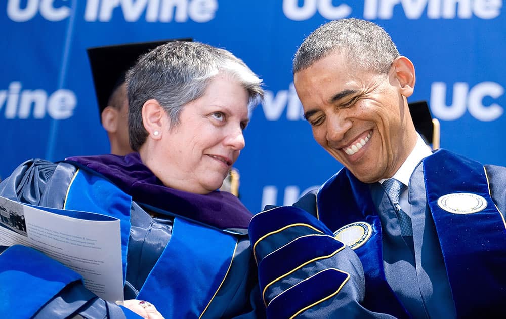 President Barack Obama, right, shares a laugh with UC Irvine president Janet Napolitano during UC Irvine`s 2014 commencement ceremony at Angel Stadium in Anaheim, Calif.