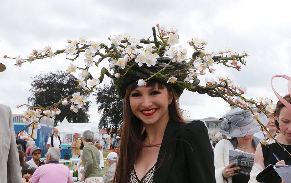 Spectators wearing hats are seen prior to the Prix de Diane horse race, a flat horse race open to fillies, in Chantilly, west of Paris.