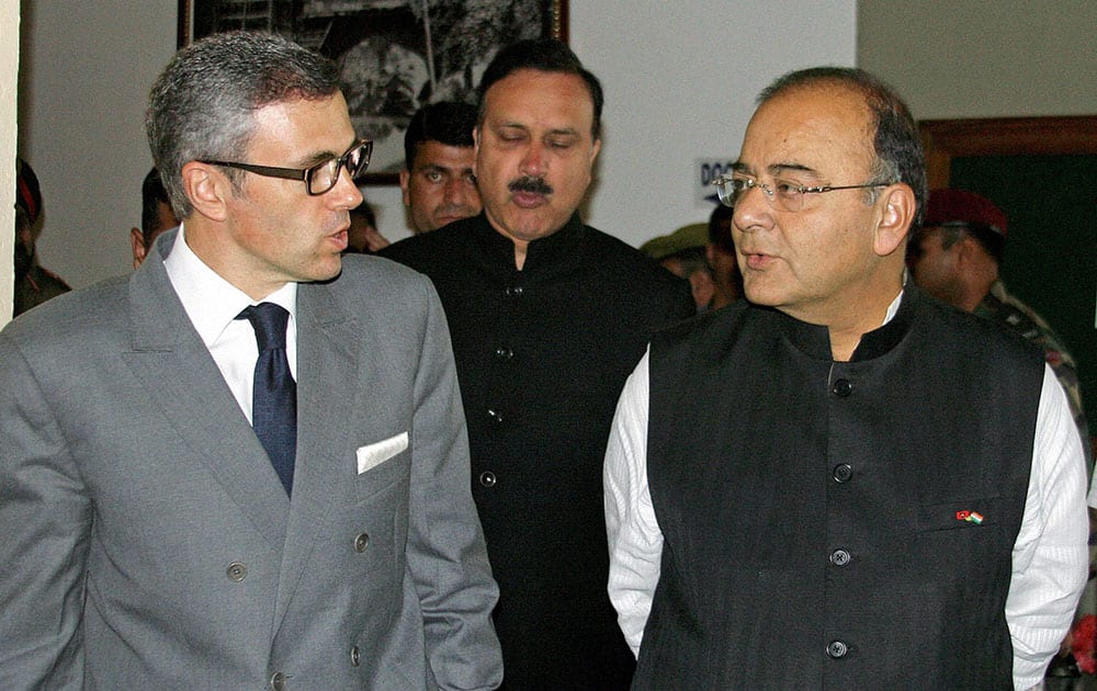 Defence Minister Arun Jaitley with J&K Chief Minister Omar Abdullah leaving after chairing a unified headquarters meeting at SKICC in Srinagar.