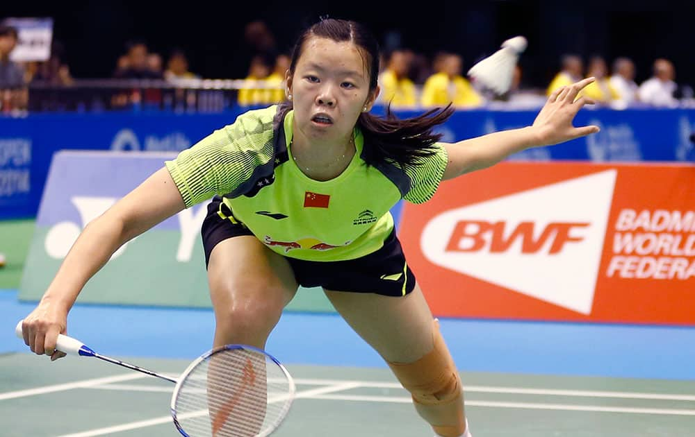 China`s Li Xuerui returns a shot against Tai Tzu-ying of Taiwan during their final match of the Japan Open badminton championship.