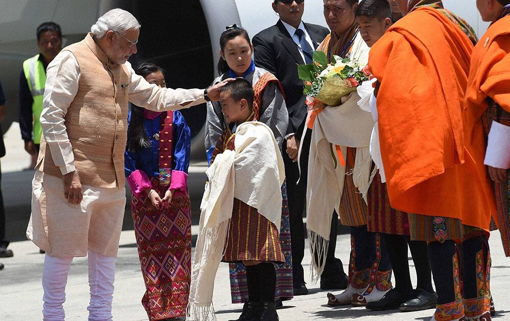 Prime Minister Narendra Modi is welcomed on his arrival at the Paro International Airport in Bhutan.