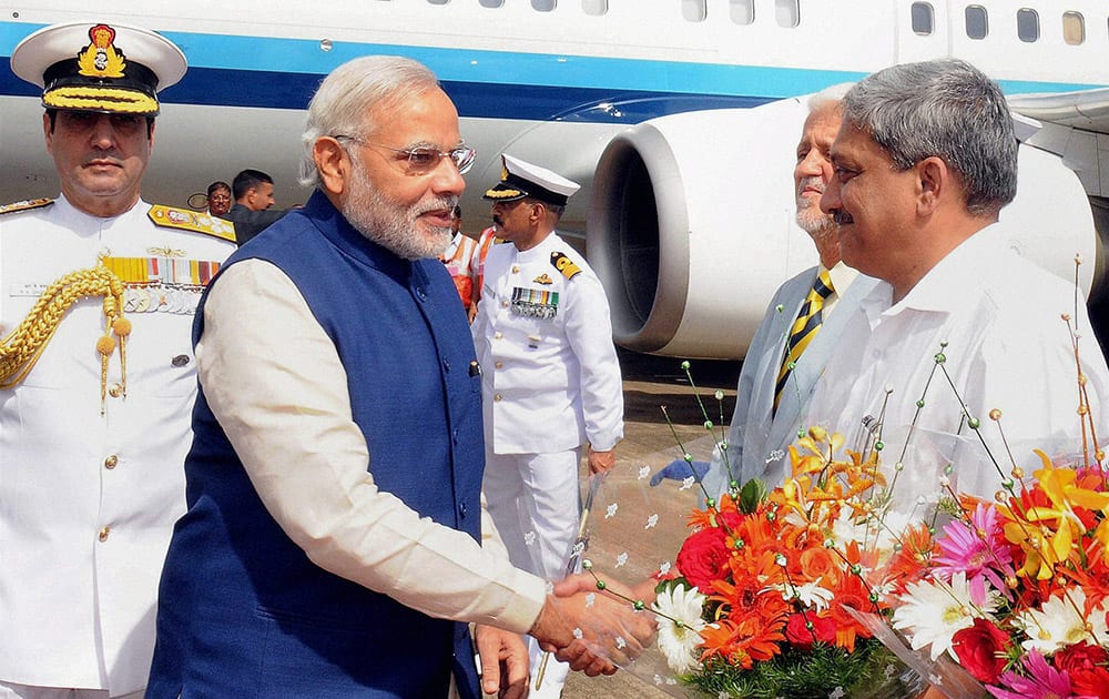 Prime Minister Narendra Modi being welcome by Goa Chief Minister Manohar Parriker on his arrival at INS Hansa airbase at Dabolim in Goa.