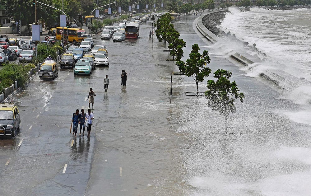 A high tide inundates Marine drive in Mumbai.