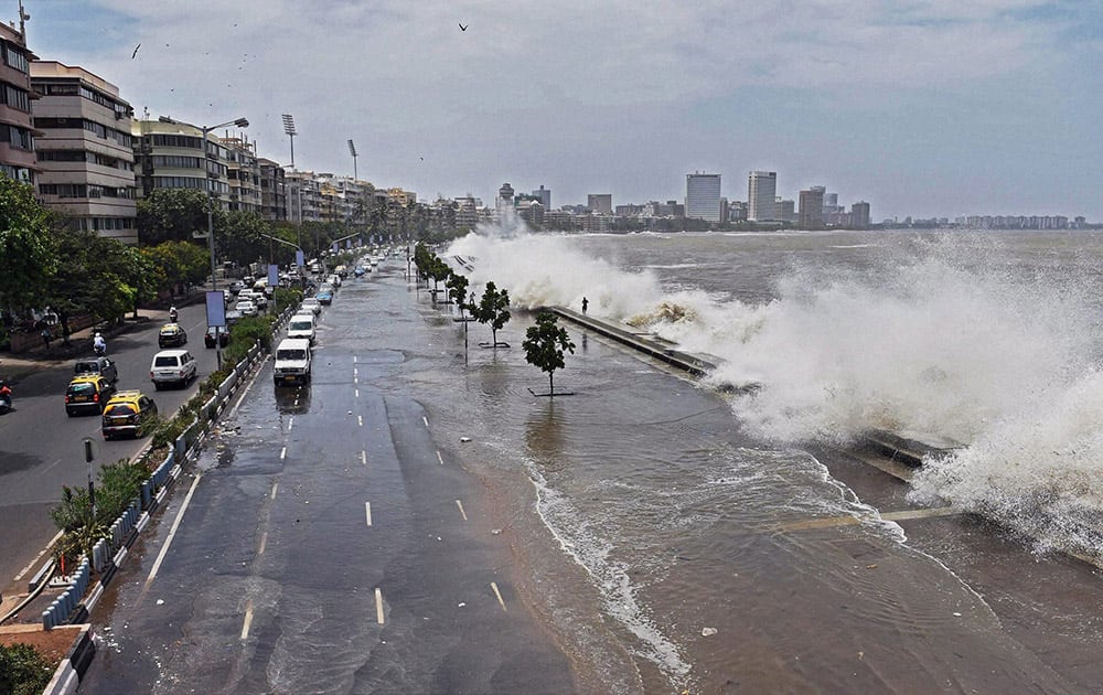 A high tide inundates Marine drive in Mumbai.