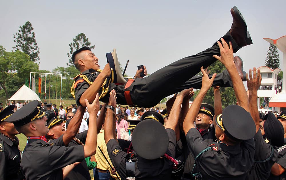 J. Dorji, the only Gentlemen Cadet (GC) from Bhutan, is tossed in the air by his colleagues at an India Military Academy passing out parade ceremony in Dehradun.