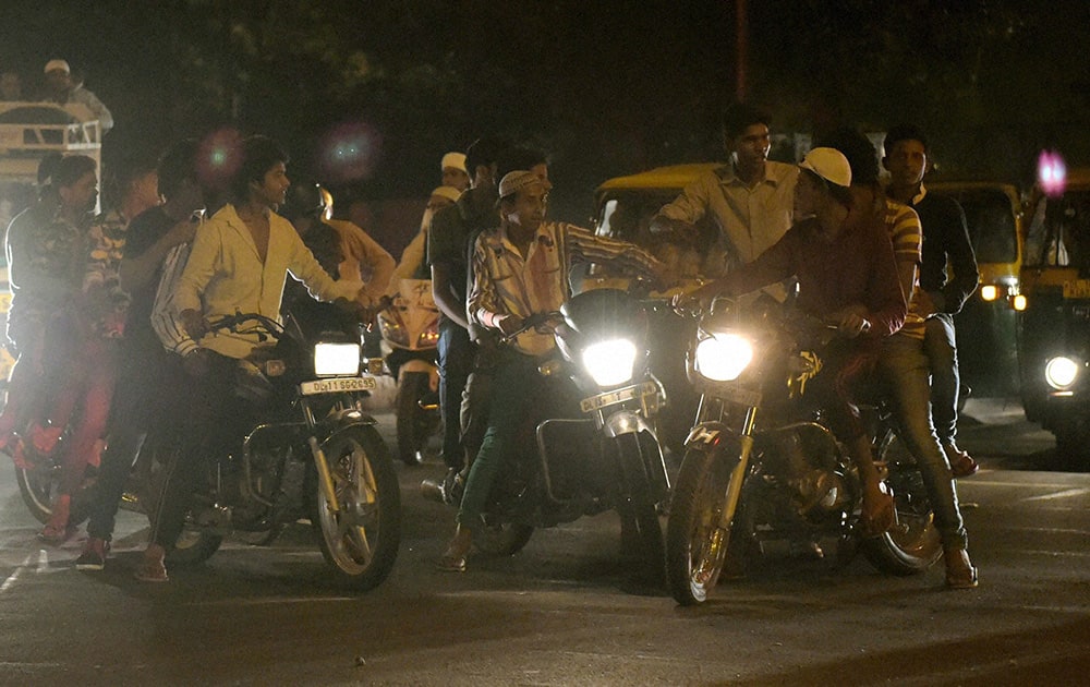 Bikers at a road near Raj Ghat on the occaision `Shab-e-Barat`, in New Delhi.