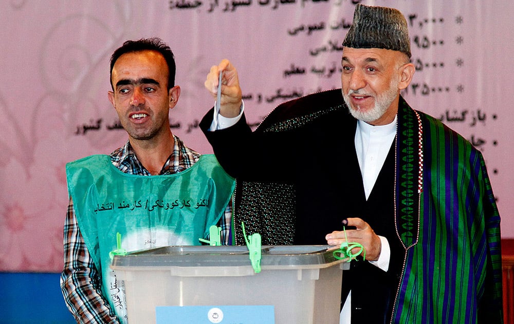 Afghan President Hamid Karzai casts his ballot at a polling station in Kabul, Afghanistan.