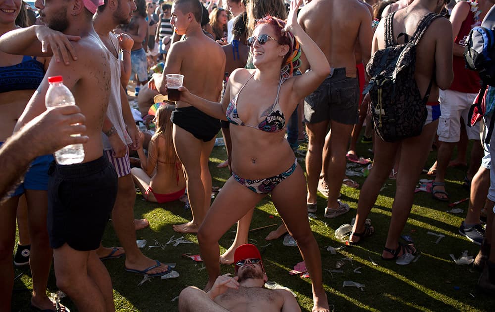 Israelis dance during the annual Gay Pride Parade on a street of Tel Aviv, Israel.