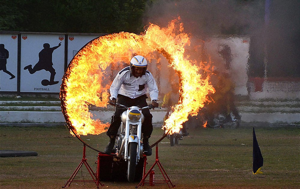 A gentleman cadet performs a stunt at a passing out parade at Officers Training Academy in Gaya.