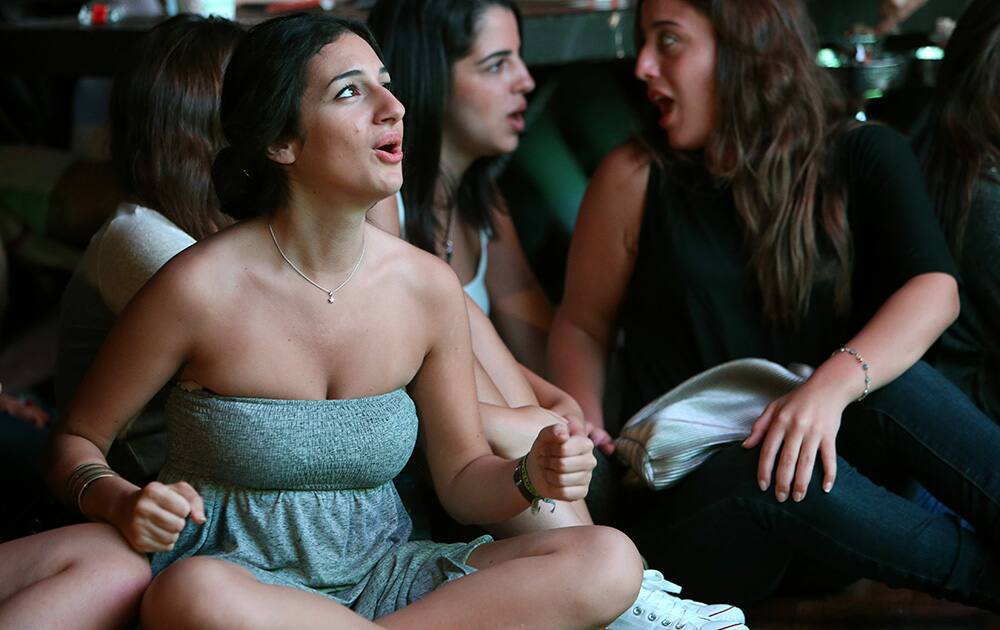 A Lebanese soccer fan reacts after Croatia scored against Brazil, during the first soccer match of World Cup at a fan park, in downtown Beirut, Lebanon.