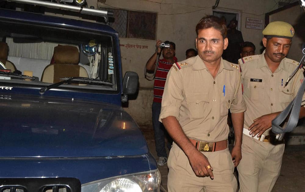 Sub-Inspector Rahul Pandey (L) is arrested for allegedly raping a 24-year-old woman in Hamirpur district.