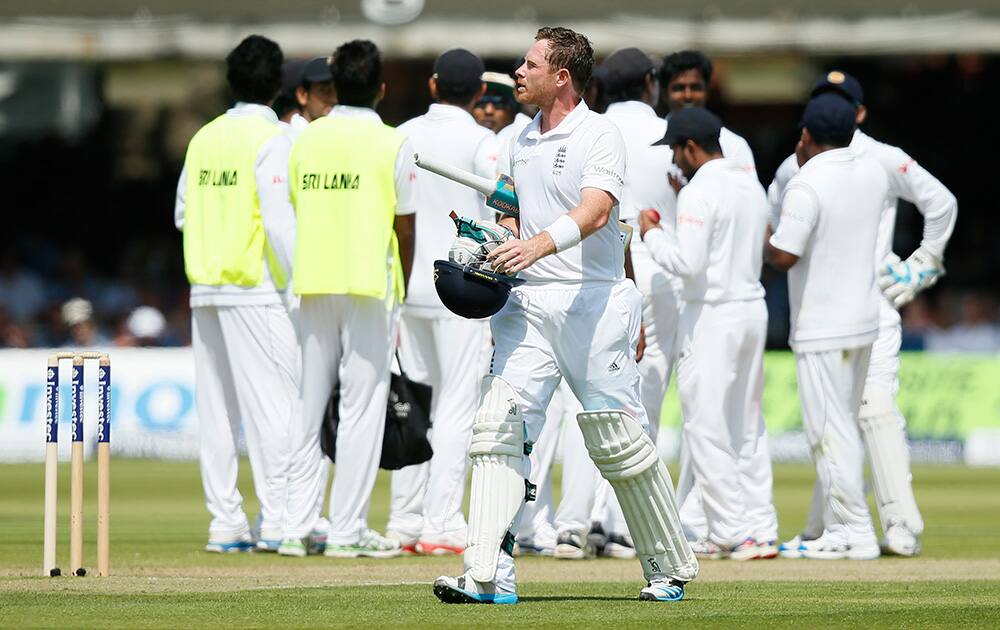 England`s Ian Bell walks off the pitch after being given out lbw on the first day of the first test cricket match between England and Sri Lanka at Lord`s cricket ground in London.